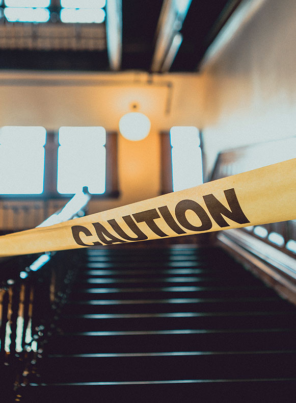 Caution tape in front of stairs