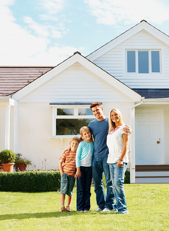 Family in front of a house