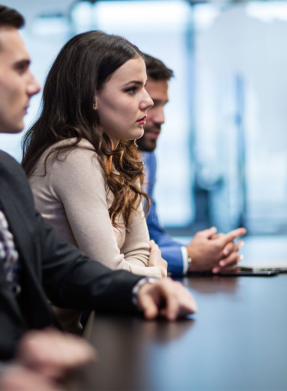 Woman at a conference room table