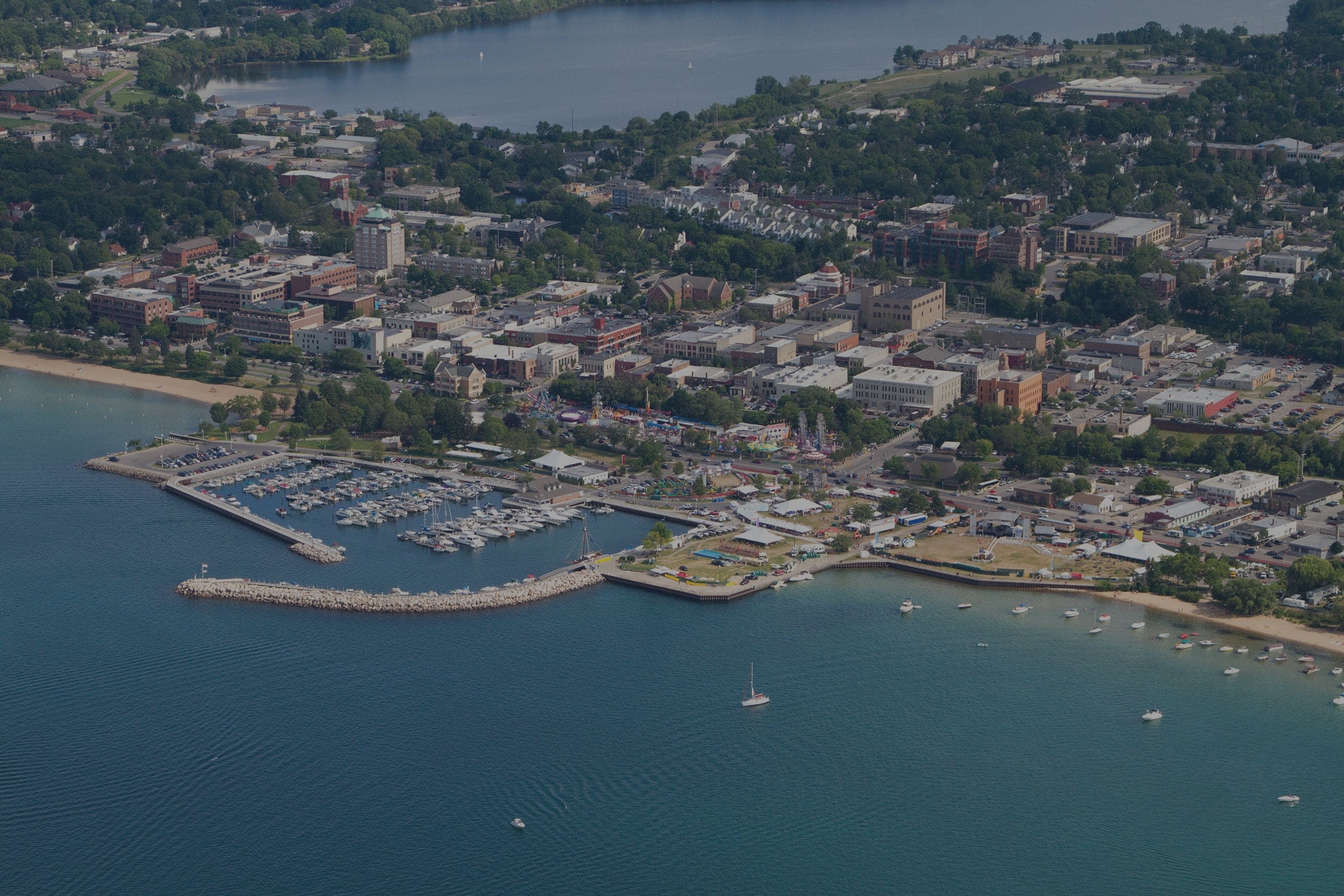 Grand Traverse Bay with About Our Northern Michigan Lawyers Text