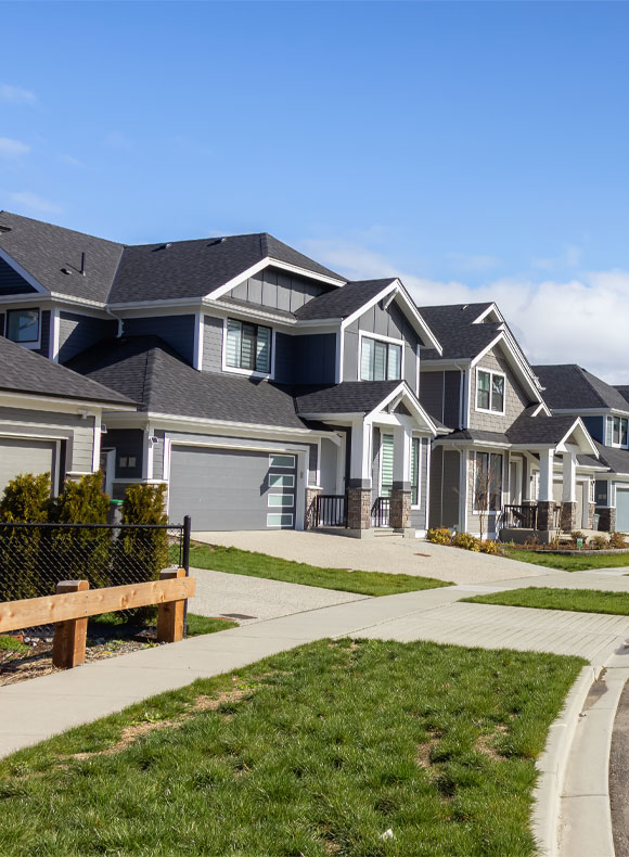 Sidewalk view of houses in neighborhood