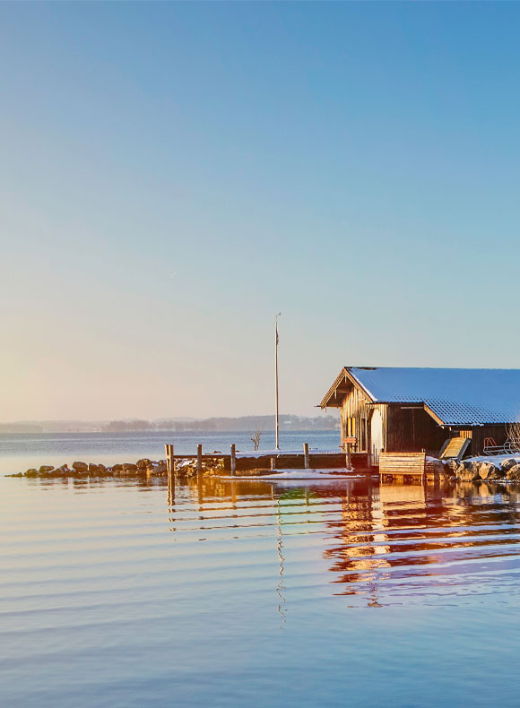 Cabin on the lake shore in the winter