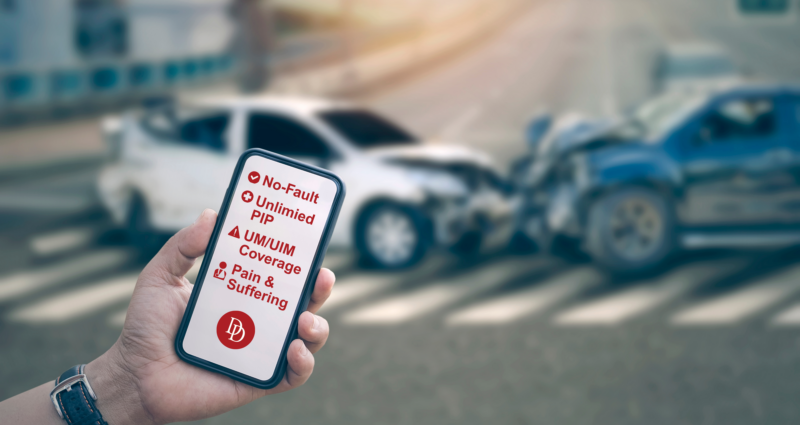 Background includes an image of an auto accident. Foreground shows a hand holding a phone listing auto accident coverage